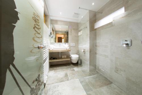 a bathroom with a toilet and a sink at Apart Val Sula in Sankt Anton am Arlberg