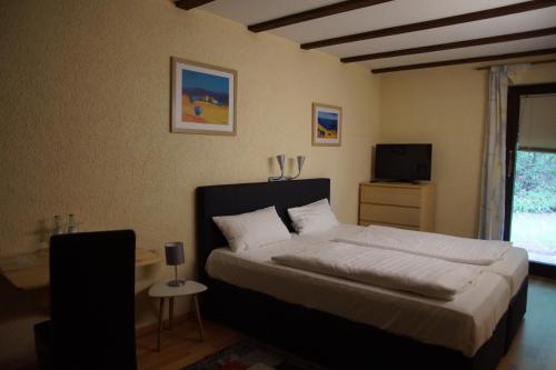 Postel nebo postele na pokoji v ubytování Seminarhotel Jakobsberg