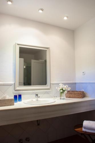 a bathroom with a sink and a mirror at Finca Ca'n Quatre in Sóller
