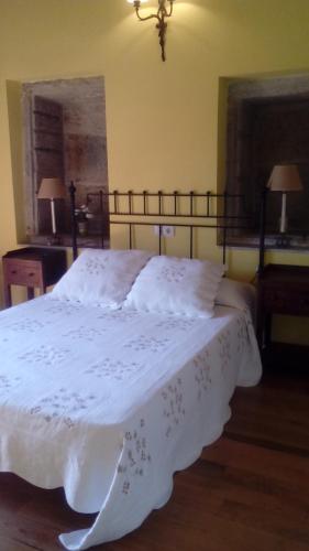 En eller flere senger på et rom på Casa Rural Anxeliña