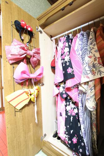 a closet filled with shirts and bows at 2 floors japanese style, direct to KIX, 10mins train to Namba, 5mins walk to stn , 2-6ppl in Osaka