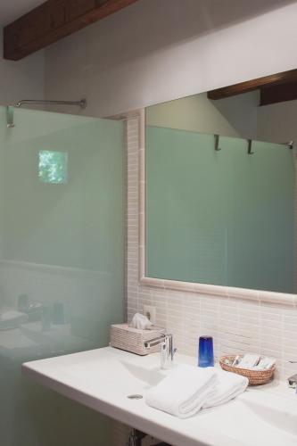 a bathroom with a sink and a mirror at Finca Ca'n Quatre in Sóller