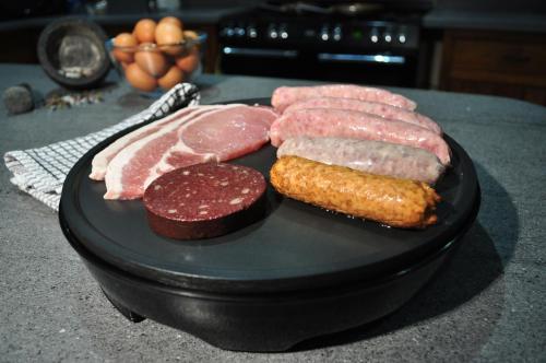 a plate of different types of meat on a counter at Canford Crossing in Wimborne Minster