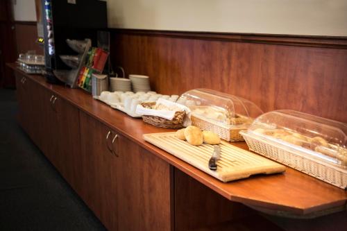 a counter with some food on top of it at Hotel Marttel in Karlovy Vary