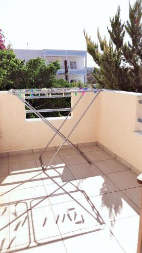 a metal structure sitting on the side of a wall at Sozia in Perdhika
