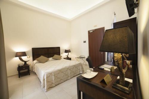 A bed or beds in a room at La Civetta