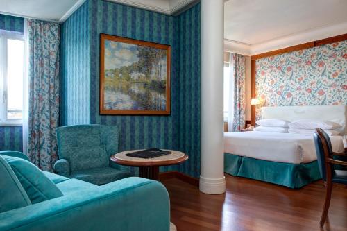 Posteľ alebo postele v izbe v ubytovaní Hotel Capitol Milano