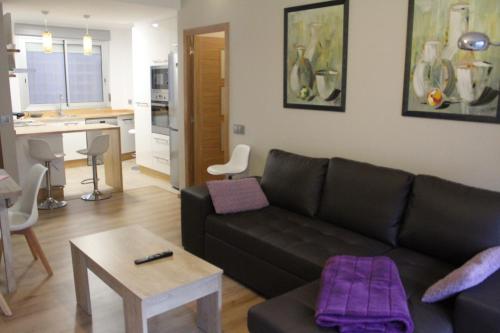 a living room with a couch and a table at Rosalía de Castro, 41 - Centro - VUT-CO-01904 in Santiago de Compostela