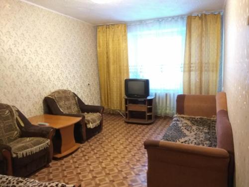 
A seating area at Apartment Zyryanovsk on Frunze 53
