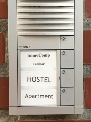 a hospital appointment sign in a box on a wall at Dormitorium Kaarst Wohnraum auf Zeit in Kaarst