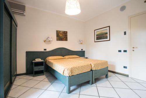 a bedroom with a bed in a room at Hotel Kyrton in Forte dei Marmi