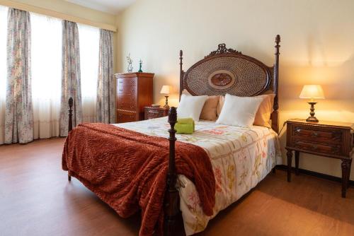 سرير أو أسرّة في غرفة في Casa Fatima