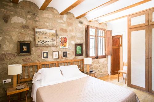 Säng eller sängar i ett rum på La Casa de Los Moyas