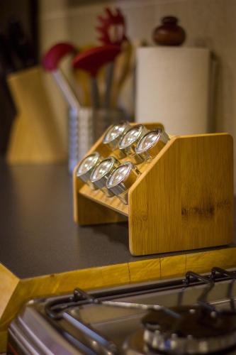 a wooden block of spoons sitting on top of a counter at Cabañas Peumayen in Puerto Varas