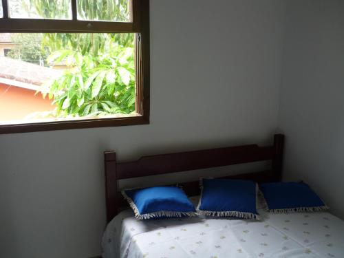 Cama ou camas em um quarto em Chalés Santorini