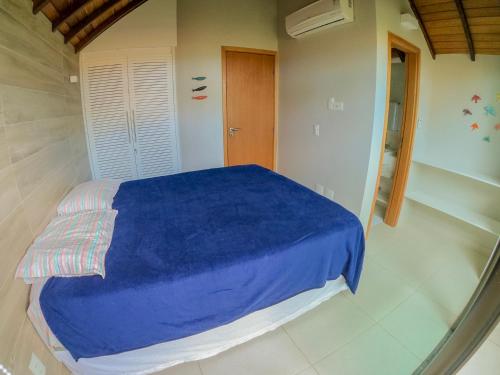 En eller flere senger på et rom på Bangalô Luxo Praia dos Carneiros