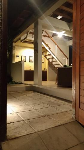 an empty room with a staircase in a building at The Lumbung Wood Villa in Seminyak