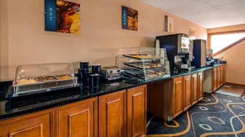 a kitchen with a counter with food on it at Best Western White Mountain Inn in Franconia
