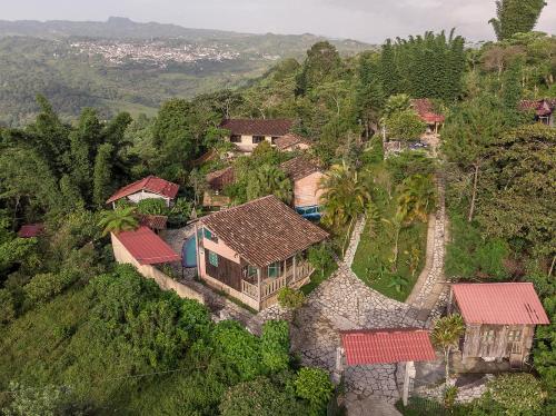 an aerial view of a house on a hill at Cabañas Los Achicuales in Cuetzalán del Progreso