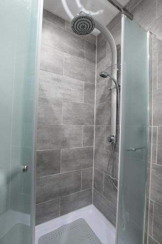 a bathroom with a shower with a glass door at Haus Sybille in Pölich
