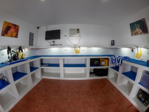 a room with a blue and white counter top at Blue Ribbon Dive Resort in Mabini
