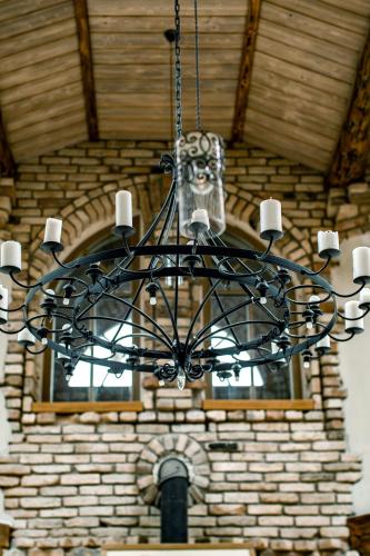 a chandelier hanging in front of a building at Prūsiškių dvaras in Sumiliszki