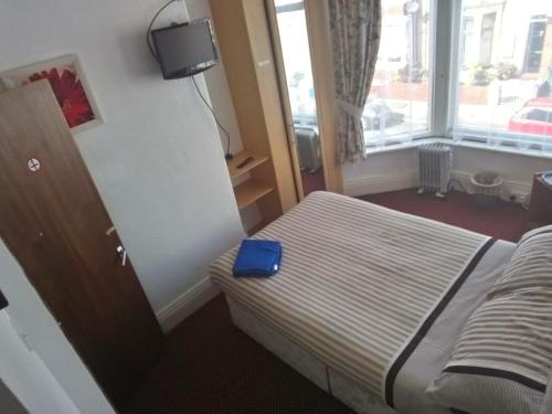 Ένα ή περισσότερα κρεβάτια σε δωμάτιο στο MyRoomz Golden Strand Hotel