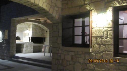 a view of a stone building with a window at Stonehouse villas with breathtaking view in Sitia