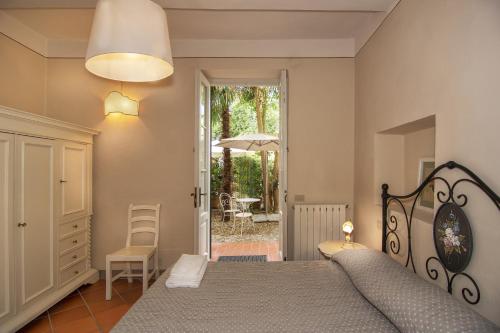 Säng eller sängar i ett rum på Corte Meraviglia - Relais