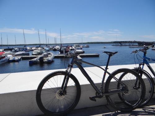 a bike parked next to a marina with boats at Villa "Schöni" in Senftenberg
