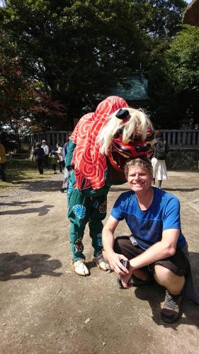 a woman kneeling next to a person wearing a costume at Live Cafe Hisui no Umi in Itoigawa