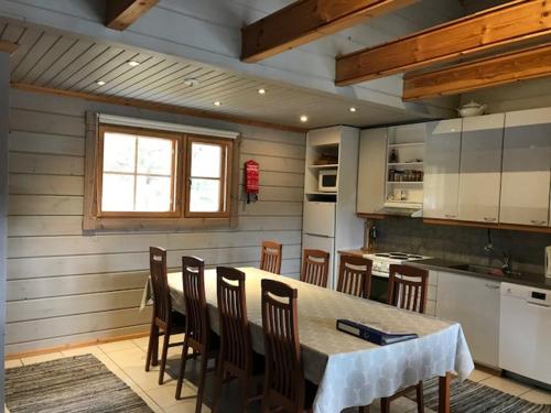 A kitchen or kitchenette at Ylä-Saarikko Holiday Cottages