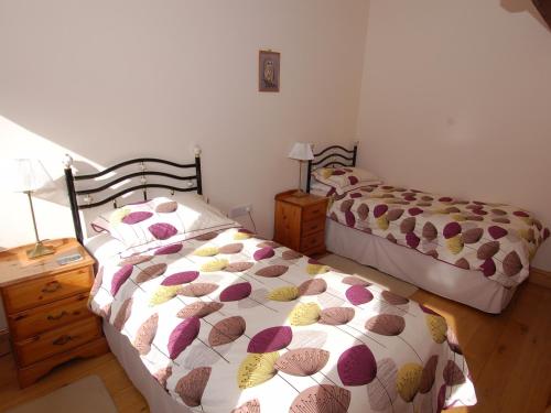 En eller flere senge i et værelse på The Milking Parlour