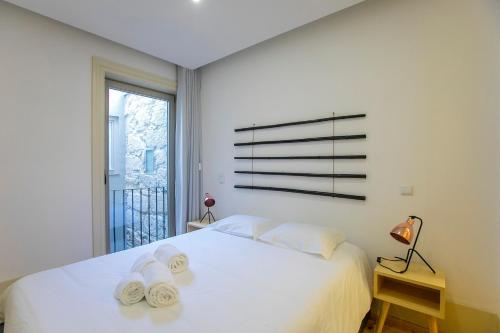 Кровать или кровати в номере Cedofeita Bohemian Lifestyle Apartment