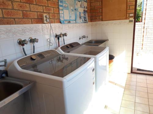 a kitchen with a sink and two sinks at Villa Eight in Kalbarri