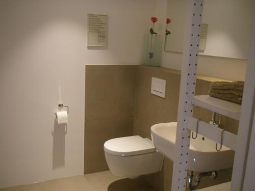 a bathroom with a toilet and a sink at Studio3 in Eisenach