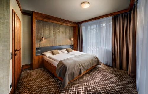 Cama o camas de una habitación en Hotel Pošta