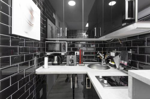 Kuchyň nebo kuchyňský kout v ubytování Argüelles Apartment