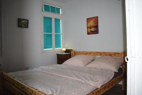 Кровать или кровати в номере Guest House Mundzic- Sumski Mir