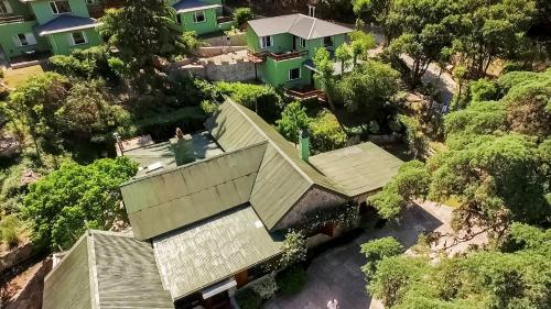 an overhead view of a house with trees at Terrazas de Cruz Chica. in La Cumbre