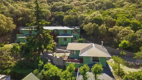 an aerial view of a house in the forest at Terrazas de Cruz Chica. in La Cumbre