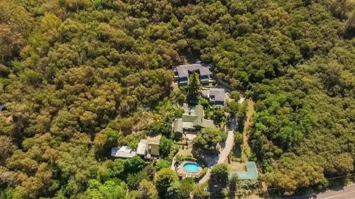 an aerial view of a house in the woods at Terrazas de Cruz Chica. in La Cumbre