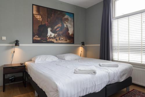 Postel nebo postele na pokoji v ubytování Westerpark Home