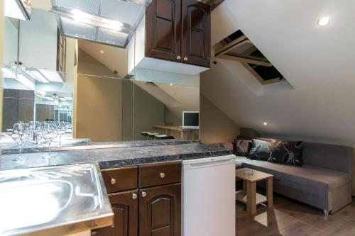 a kitchen with a sink and a counter top at Central Park Apartments in Belgrade