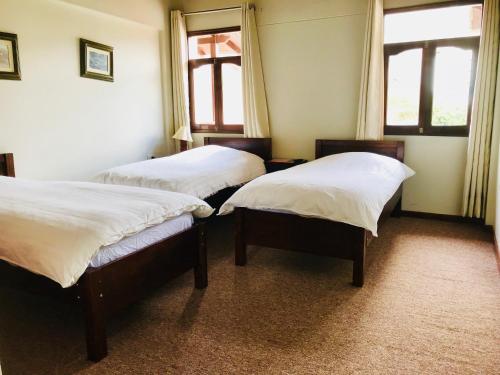 Postel nebo postele na pokoji v ubytování Hotel Santa Cruz