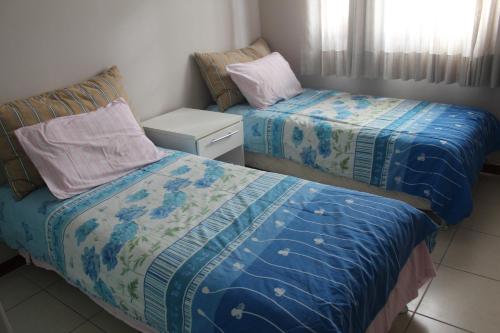 เตียงในห้องที่ Praia do Forte Luxuoso Village