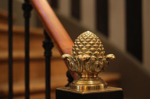 a gold pineapple on the side of a staircase at Villa Glamour in Paris