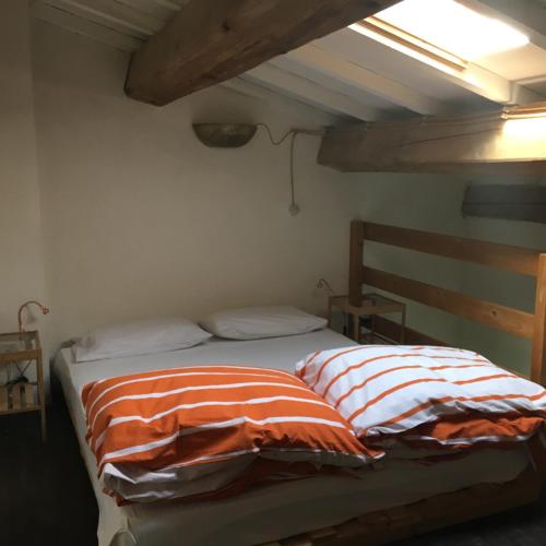 a bedroom with two beds in a room at La Fratta Art - House in Marsciano