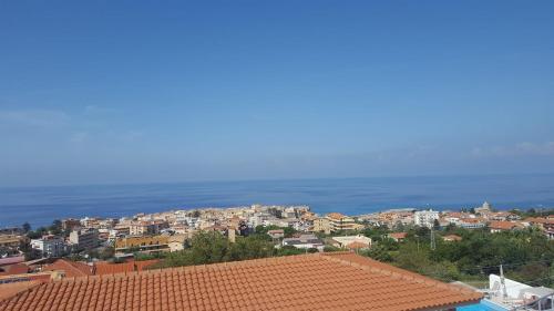 a view of a town with a red roof at Appartamenti Borgo Panoramico n.1 in Tropea