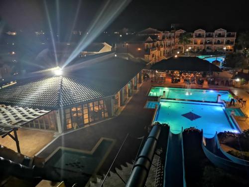 a view of a swimming pool at night at Sidari Waterpark in Sidari